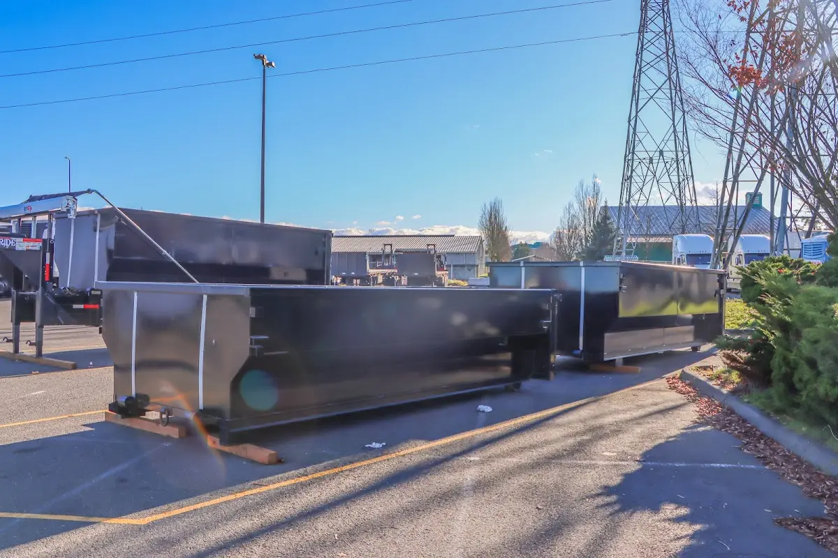 Roll-off dumpster ready for waste disposal at job site for 2 Yard Dumpster Rental in Storm Lake